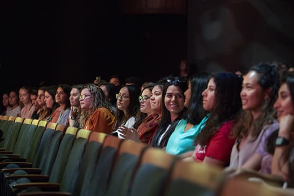 Students site in audience listening to the announcement of the Kendra Scott Women’s Entrepreneurial Leadership (WEL) Institute