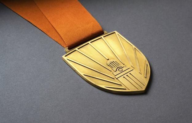 Presidents Research Impact Award gold medal with orange strap