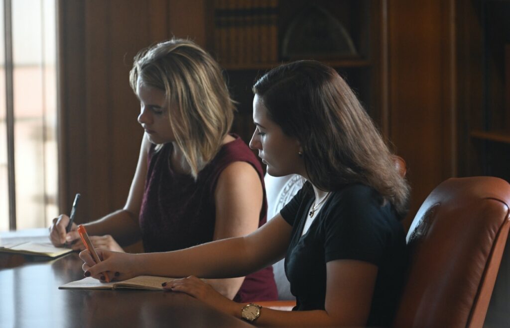 President's Student Advisory Committee Leadership takes notes in President's Office