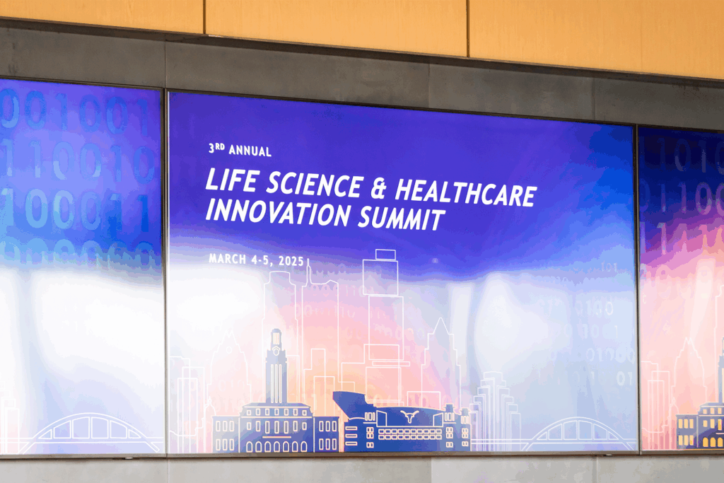 A screen displays a graphic that reads: 3rd Annual Life Science & Healthcare Innovation Summit | March 4-5, 2025